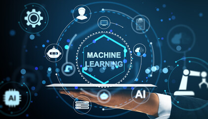 machine learning concept with digital interface icons above a hand holding tablet on futuristic ligh