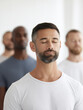 © AMK  - Group of men practicing mindfulness meditation in a serene indoor environment, showcasing relaxation and tranquility with soft lighting and calm expressions