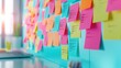 © Zenith - Colorful sticky notes with checklists are arranged on a wall near a desk, representing organization and planning in a bright, modern workspace.
