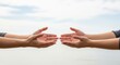 © Таня Андреева - Open hands gesturing towards each other, conveying concepts of donation, support, or exchange against a bright sky.