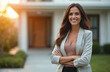 © miss irine - Smiling woman real estate agent stands proudly outside modern home. Confident American female radiates expertise, approachability. Ready assist potential house buyers. Homeowner portrait in front of