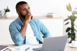 © Prostock-studio - Black Freelancer Guy Sitting At Workplace With Thoughtful Face Expression, Pensive African American Man Looking Away, Waiting For Inspiration While Working With Laptop At Home Office, Free Space