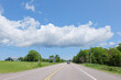 © wei - summer road view with blue sky and clouds, prince edward island Canada