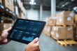 © Sudaporn - Hands Holding Tablet Displaying Data Analytics in a Warehouse, Illustrating Supply Chain Management and Digital Transformation for Business Intelligence : Generative AI