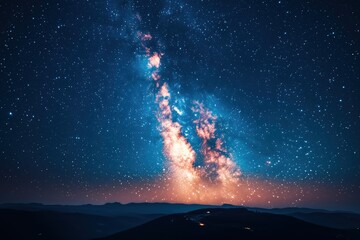 Wall Mural - stunning milky way galaxy streaking across a dark night sky with countless stars and distant mountai