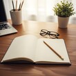 © arastudio - Open notebook with pencil, glasses, laptop, and plant on a wooden desk