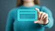 © Aris Suwanmalee - A woman holds a digital card, showcasing technology and modern business solutions.