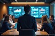 © Vadym - Business team meeting discussing graphs data on screen. Modern office, diverse employees group. Analyzing financial strategy, business plan success. Man in suit looks at data charts. Colleagues in