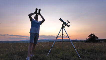 Canvas Print - amateur astronomer using telescope and binoculars for watching stars, moon, planets and other celest