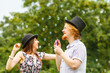 © Voyagerix - Couple blowing soap bubbles, having fun