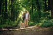 © standret - Man tourist is with his dog in the forest