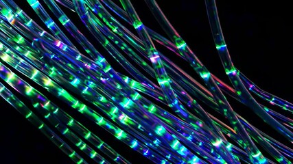 Wall Mural - fiber optic cables are transmitting data with glowing green and blue lights in a dark environment, c
