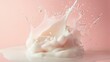© Juan - Milk splashing energetically into glass against soft pink backdrop capturing fluid motion in food photography