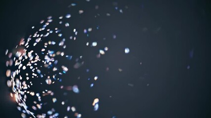 Wall Mural - abstract sphere exploding into colorful particles on a dark background, creating a mesmerizing visua