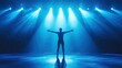 © ganthari - Silhouette of a person on stage under spotlights