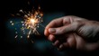 © sirisakboakaew - Celebrating new year's eve with sparkler in hand home photography nighttime close-up festive spirit