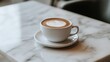 © nurdin - Aromatic cappuccino adorned with latte art, presented on an elegant marble table