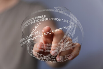 hand interacting with a translucent sphere of data, showcasing digital information and technology.