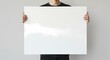 © weekung69 - A person holding a blank white poster horizontally, suitable for adding text.