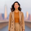 © Chalit - Confident Woman in Beige Coat on City Bridge