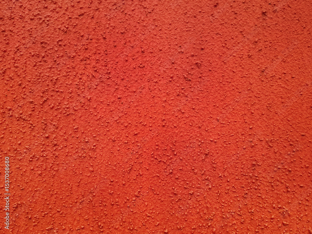 Background of scarlet red rough plaster wall. Hand painted wall surface ...