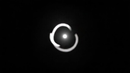 Wall Mural - abstract animation of a glowing circle rotating in a dark space over time