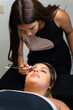© Alfonso Soler - Beautician applying eyebrow lamination treatment to client in beauty center