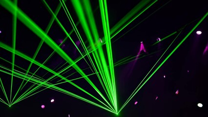Wall Mural - green laser beams create a dynamic light show, crisscrossing against a dark backdrop with purple acc