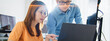 © Urbanscape - Asian male, female programming developer work together at home office, brainstorm discussion. Information technology, software engineer programmer coding job, man and woman coworker teamwork concept