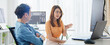 © Urbanscape - Asian male, female programming developer work together at home office, brainstorm discussion. Information technology, software engineer programmer coding job, man woman coworker teamwork. Copy space