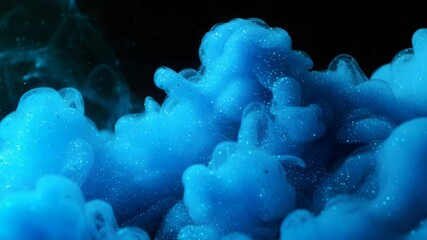Wall Mural - ethereal blue glitter powder swirling in liquid against a black backdrop creating a dreamlike visual