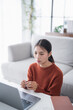© Charlie's - Asian Businesswoman VDO Call Conference Work  talk chat online video call on laptop webcam conference working with laptop online briefing E learning and social distancing concept.