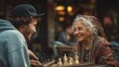 © PhotoStudioWizard - Man and an old woman are playing chess