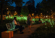 © Sitaram - Futuristic Solarpunk Urban Park at Dusk with Bioluminescent Trees and Solar Benches