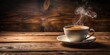 © Naowarat - Aromatic coffee cup filled with steaming hot coffee on a wooden table