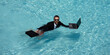 © Volodymyr - Business man in suit working on laptop in swimming pool. Travel tourism and business concept. Crazy male office employee using laptop in pool on summer day. Office conditioner concept.