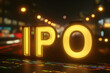 © Pukan - Glowing golden 'IPO' letters illuminated against a blurred city street backdrop, symbolizing initial public offerings in finance and stock markets.