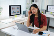 © Phimwilai - Stressed asian businesswoman having headache while working with laptop in office