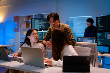 asian software engineer or programmer team working late in development office,problem solving or alg