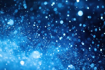Wall Mural - Sparkling Blue Bokeh Background with Glittering Light Particles.
