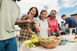 © DisobeyArt - Multigenerational people doing barbecue at home's rooftop - Multiracial friends having fun eating and cooking together during weekend day - Summer and food concept - Main focus on african woman face