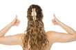 © vladimirfloyd - Back view of woman with wavy blonde hair in half-up style using beige claw clip, giving thumbs up gestures with both hands against white background