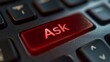 © Yuyun - Close-up of a glowing red 'Ask' key on a dark keyboard