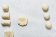 © this_baker - Overhead view of baozi dough being shaped over white granite countertop, top view of mantou dough being divided on granite countertop, process of making bao buns