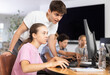 © JackF - Curious underage girl engaged in IT training with help of teacher in computer courses
