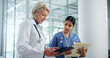 © peopleimages.com - Healthcare, teamwork and tablet with people in hospital for discussion, doctor report and mentor. Medical review, digital patient files and collaboration with women in clinic for research and nurse
