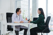 © Wicitr - Doctor Consulting with Patient in Office