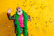 © deagreez - Photo of excited old man showman confetti discoball dance wear glamour striped bright clothes boa sunglass isolated yellow color background