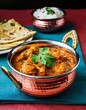 © Outside Studio - Delicious Indian Butter Chicken Curry Served in Copper Bowl with Rice and Naan Bread - Authentic Indian Cuisine, Food Photography