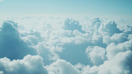 Wall Mural - aerial view of clouds from an airplane window